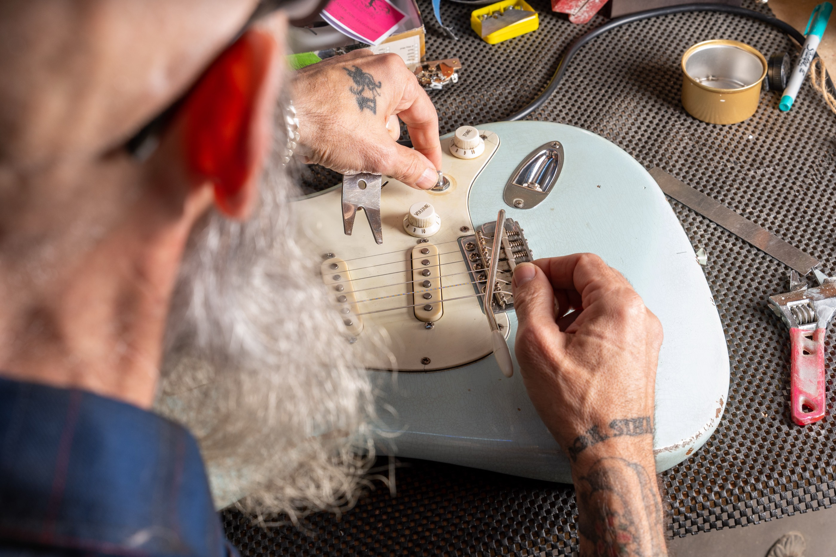 John bent over Echo's guard, fitting the screws